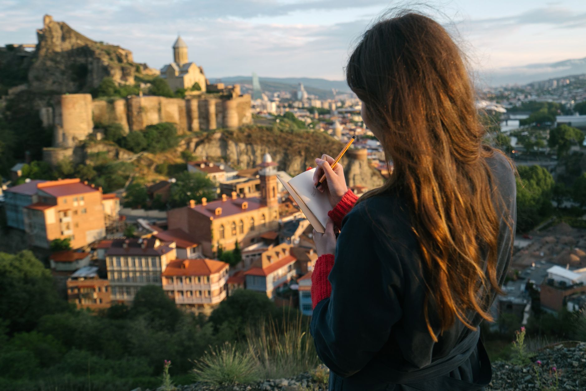 Travel writer documenting in scenic solitude