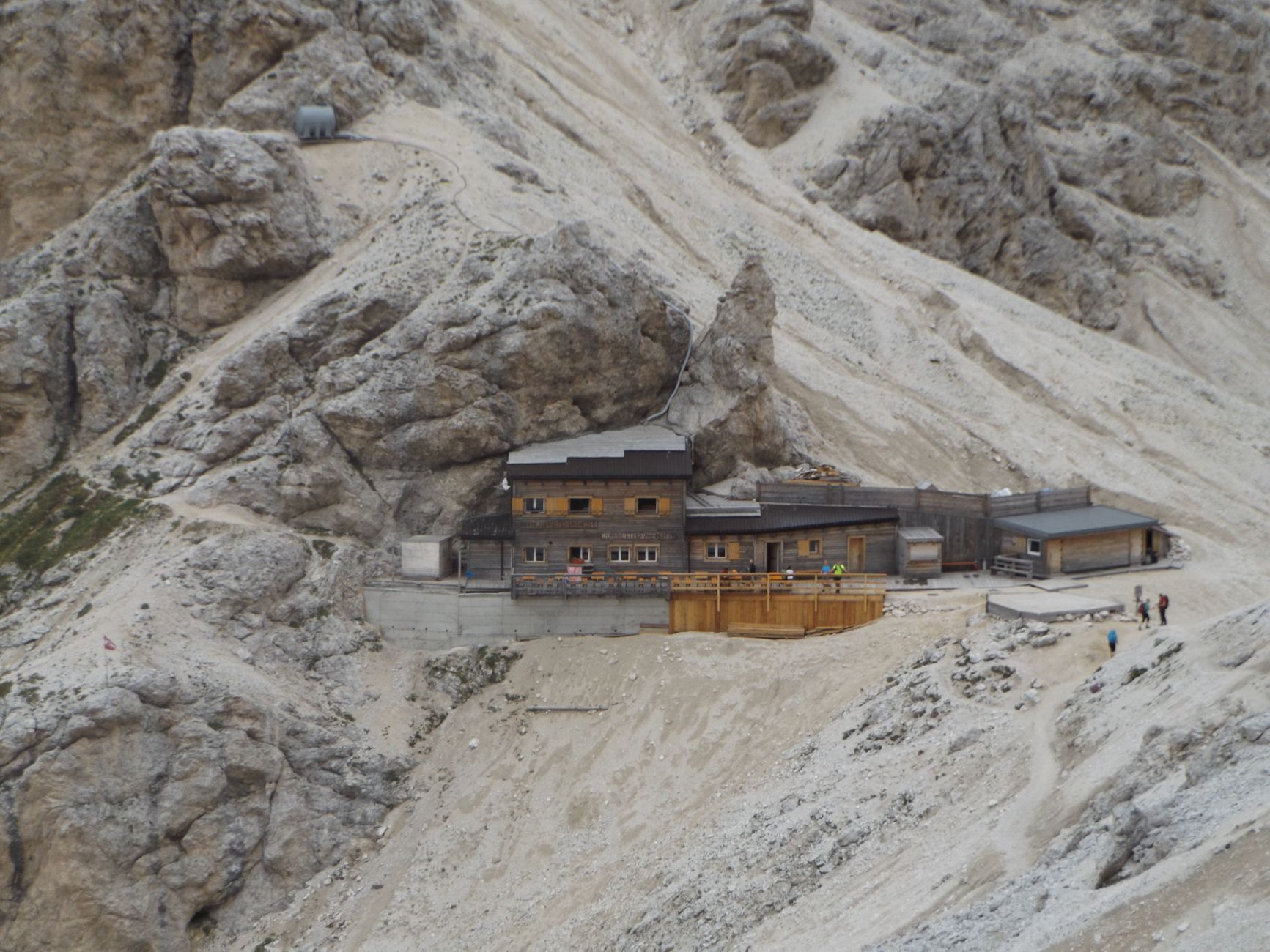 High altitude Alpine peaks and wooden shelter